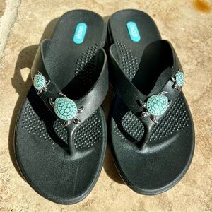 Black turtle flip flop sandals by Oka B